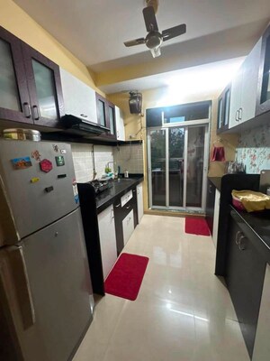 Kitchen in 2 BHK Apartment at Mahavir Kalpavruksha, Ghodbunder Road – for Sale