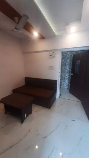 Living Room in Studio Apartment at Royal Palms, Goregaon East – for Rent