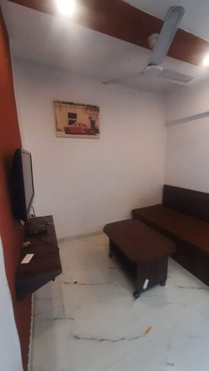 Living Room in Studio Apartment at Royal Palms, Goregaon East – for Rent