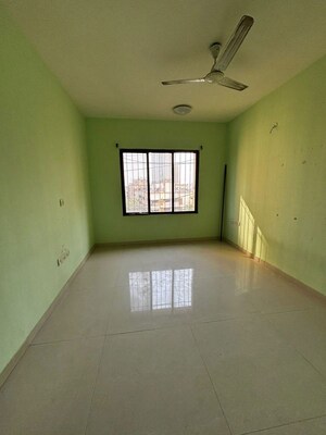 Bedroom in 2 BHK Apartment at Lalani Grandeur, Goregaon East – for Rent