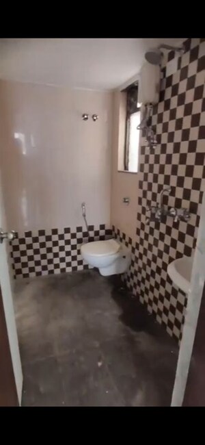 Bathroom in 1 BHK Apartment at Heena Presidency, Mira Road – for Rent