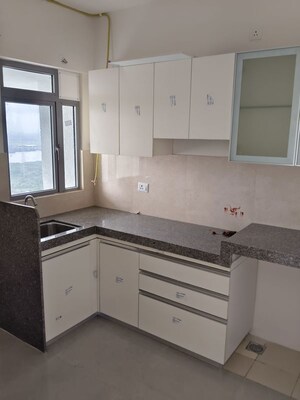 Kitchen in 2 BHK Apartment at Piramal Vaikunth, Balkum Pada – for Rent