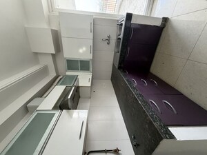 Kitchen in 2 BHK Apartment at Amrapali Eden Park, Sector 50 – for Rent