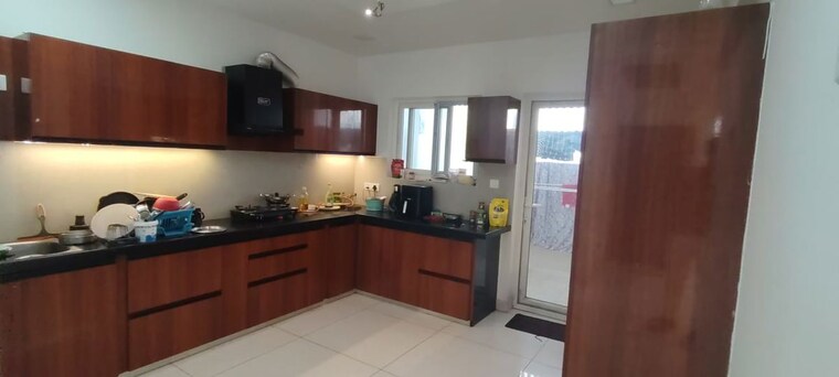 Kitchen, ambience-courtyard 3 Bedroom 2300 Sq.Ft. Apartment In Manikonda Hyderabad 10609423