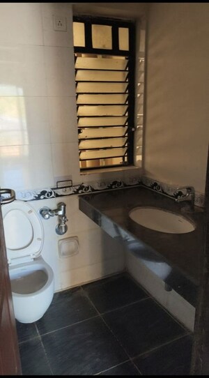 Bathroom in 1 BHK Apartment at K Raheja Heights, Malad East – for Rent
