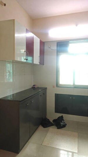 Kitchen in 2 BHK Apartment at Sai Baba Vihar Complex, Ghodbunder Road – for Rent