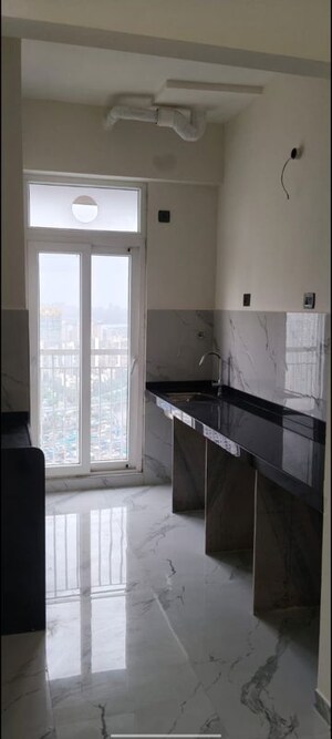 Kitchen in 2 BHK Apartment at Ruparel Sky Green, Kandivali West – for Rent