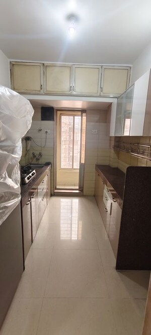 Kitchen in 2 BHK Apartment at Shanti Gardens , Mira Road – for Rent