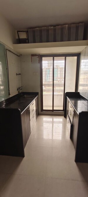 Kitchen in 2 BHK Apartment at Shanti Gardens , Mira Road – for Sale