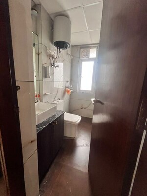 Bathroom in 2.5 BHK Apartment at Mahagun My Woods, Sector 16c Greater Noida – for Rent