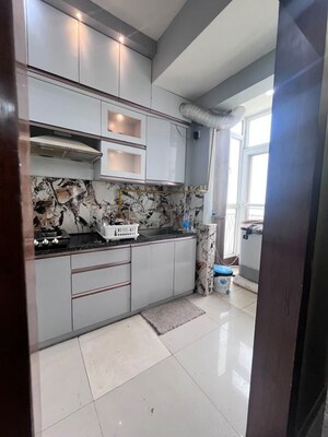 Kitchen in 2.5 BHK Apartment at Mahagun My Woods, Sector 16c Greater Noida – for Rent