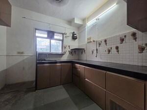 Kitchen in 3 BHK Apartment at Gokuldham Complex, Goregaon East – for Rent