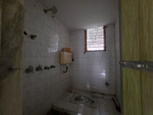 Bathroom in 3 BHK Apartment at Gokuldham Complex, Goregaon East – for Rent