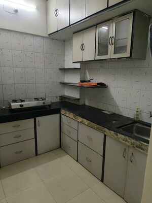 Kitchen in 1 BHK Apartment at Milind Madhura Tower, Amboli – for Rent