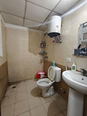 Bathroom in 2 BHK Apartment at Aims Golf City, Sector 75 – for Sale