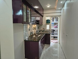 Kitchen in 2 BHK Apartment at Casa Woodstock, Sector 16c Greater Noida – for Sale