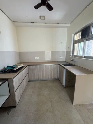 Kitchen in 3 BHK Apartment at Rodas Enclave Evergreen, Patlipada – for Rent