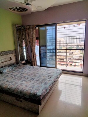 Bedroom in 2 BHK Apartment at Highland Tower, Lokhandwala – for Rent