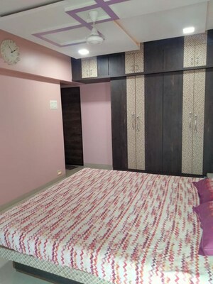 Bedroom in 2 BHK Apartment at Highland Tower, Lokhandwala – for Rent