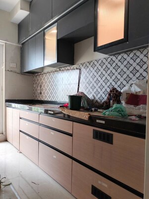 Kitchen in 2 BHK Apartment at Shree Tirupati STG Signature Residency, Patlipada – for Rent