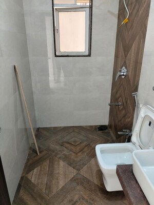 Bathroom in 2 BHK Apartment at Shree Tirupati STG Signature Residency, Patlipada – for Rent