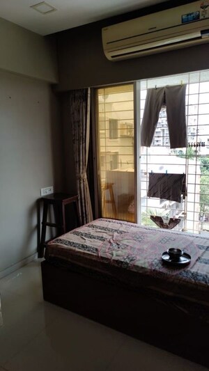 Bedroom in 2 BHK Apartment at Paras Nagar CHS Kandivali, Kandivali West – for Rent