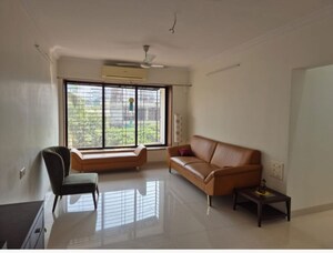 Living Room in 2 BHK Apartment at Riddhi Tower, Malad East – for Rent