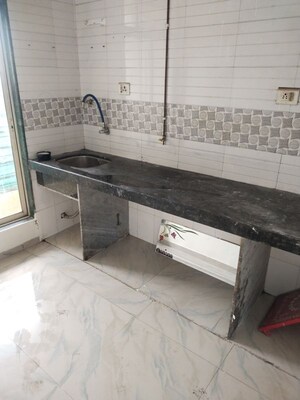 Kitchen in 1 BHK Apartment at Priya Arcade, Karanjade – for Sale