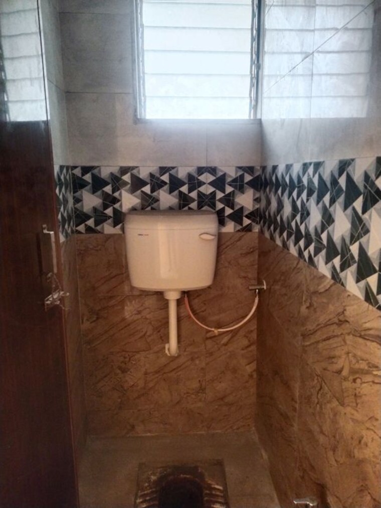 Bathroom, dev-residency 1 Bedroom 650 Sq.Ft. Apartment In Vadghar Navi Mumbai 10612787
