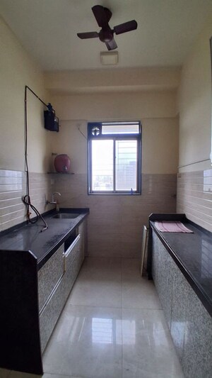 Kitchen in 1.5 BHK Apartment at Roha Satsang Bharti, Malad East – for Rent