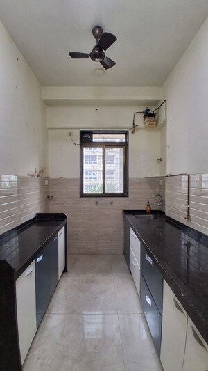 Kitchen in 1.5 BHK Apartment at Roha Satsang Bharti, Malad East – for Rent