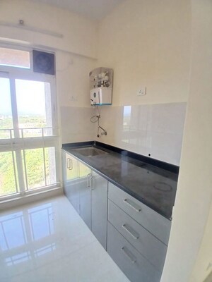 Kitchen/pantry in 1 BHK Apartment at Unnati Woods CHS, Kasarvadavali – for Rent