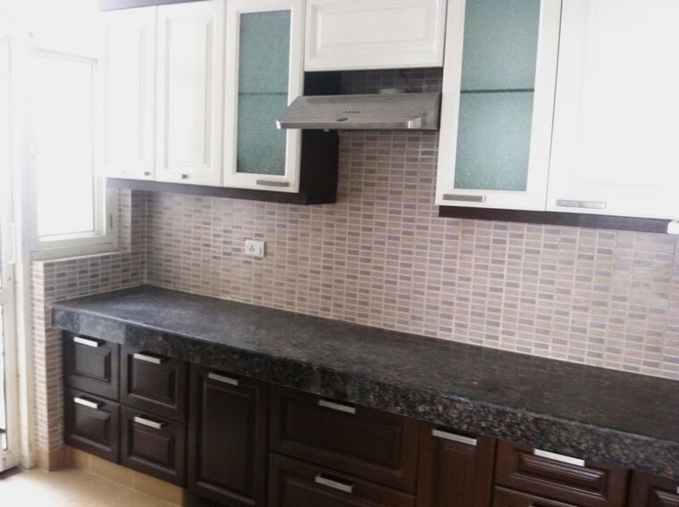 Kitchen, divine-meadows 2.5 Bedroom 1436 Sq.Ft. Apartment In Sector 108 Noida 10613679