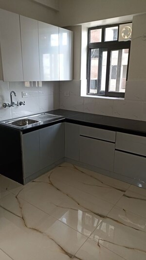 Kitchen in 2 BHK Apartment at SVP Gulmohur Garden, Raj Nagar Extension – for Sale