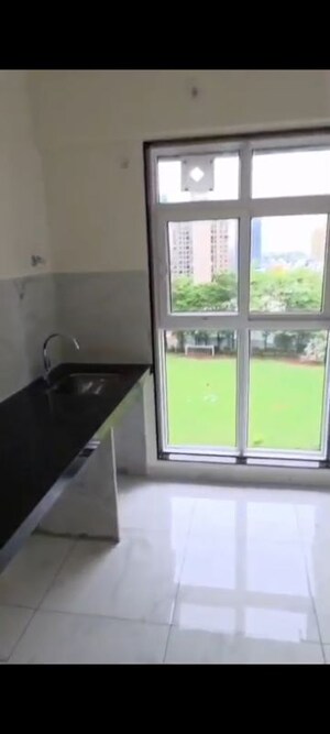 Kitchen in 2 BHK Apartment at MICL Aaradhya Parkwood, Mira Road – for Rent