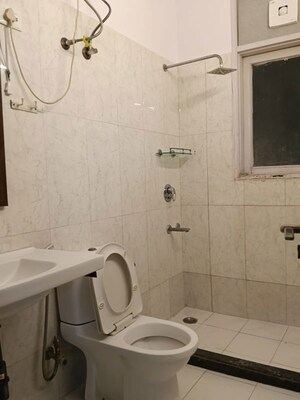 Bathroom in 3 BHK Apartment at Pamposh Enclave – for Rent