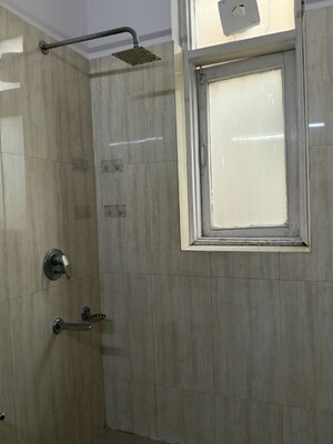 Bathroom in 3 BHK Apartment at Pamposh Enclave – for Rent