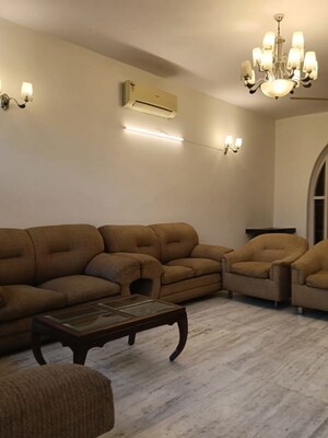 Living Room in 3 BHK Apartment at Pamposh Enclave – for Rent