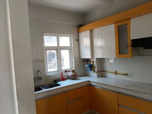 Kitchen in 3 BHK Apartment at Uninav Eden, Raj Nagar Extension – for Sale
