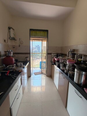 Kitchen in 2 BHK Apartment at Parshwa Girnar Tirth, Kalyan West – for Rent