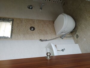 Bathroom in 3 BHK Apartment at Axis Paradigm Whistling Meadows, Paud Road – for Rent