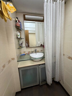Bathroom in 2 BHK Apartment at Atul Trans Residency, Andheri East – for Sale