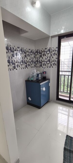 Kitchen in 1 BHK Apartment at Raunak Unnathi Woods Phase 7 A And B, Ghodbunder Road – for Rent