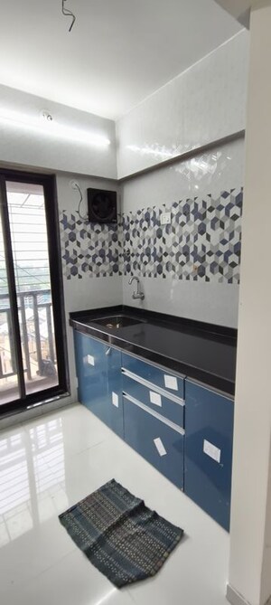 Kitchen in 1 BHK Apartment at Raunak Unnathi Woods Phase 7 A And B, Ghodbunder Road – for Rent