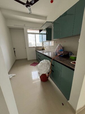 Kitchen in 2 BHK Apartment at Puranik City Reserva, Ghodbunder Road – for Rent