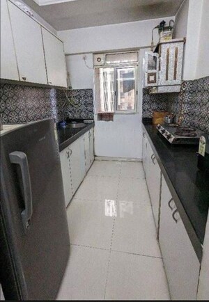 Kitchen in 1 BHK Apartment at Lodha Amara, Kolshet Road – for Sale