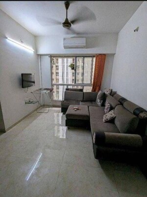 Living Room in 1 BHK Apartment at Lodha Amara, Kolshet Road – for Sale
