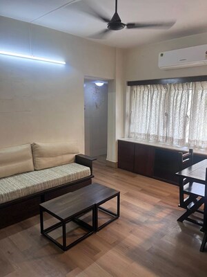 Living Room in 2 BHK Apartment at Oshiwara – for Rent