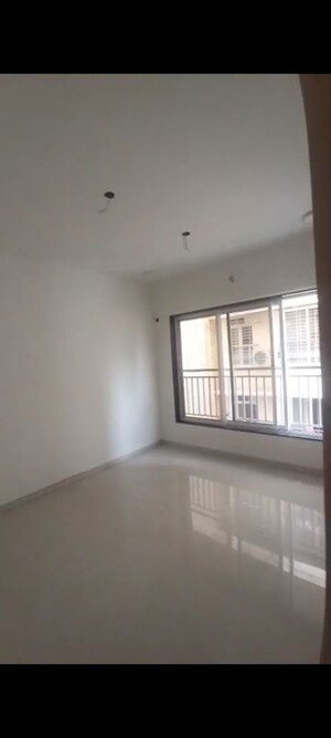 Room in 1 BHK Apartment at Vardhman Om Shri Ganesh CHS, Kandivali West – for Sale
