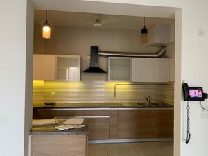 Kitchen in 3 BHK Apartment at ABA Cleo County, Sector 121 – for Rent